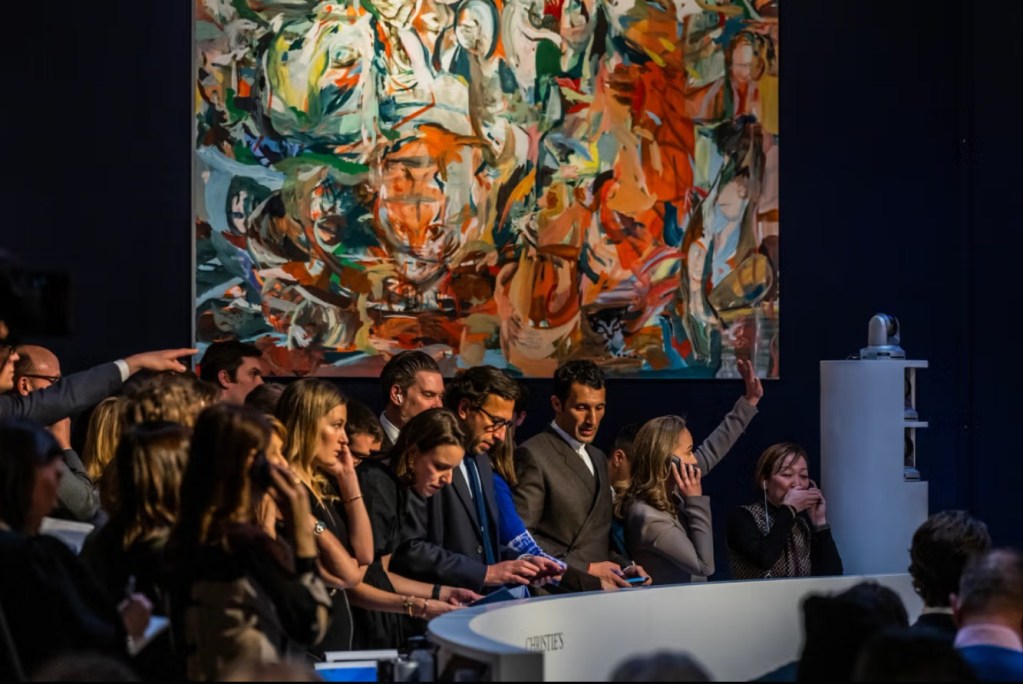 Bidders and auction staff during a live evening sale at Christie’s New York. The upcoming May 18, 2026 sale will feature Roy Lichtenstein’s Anxious Girl (1964).

