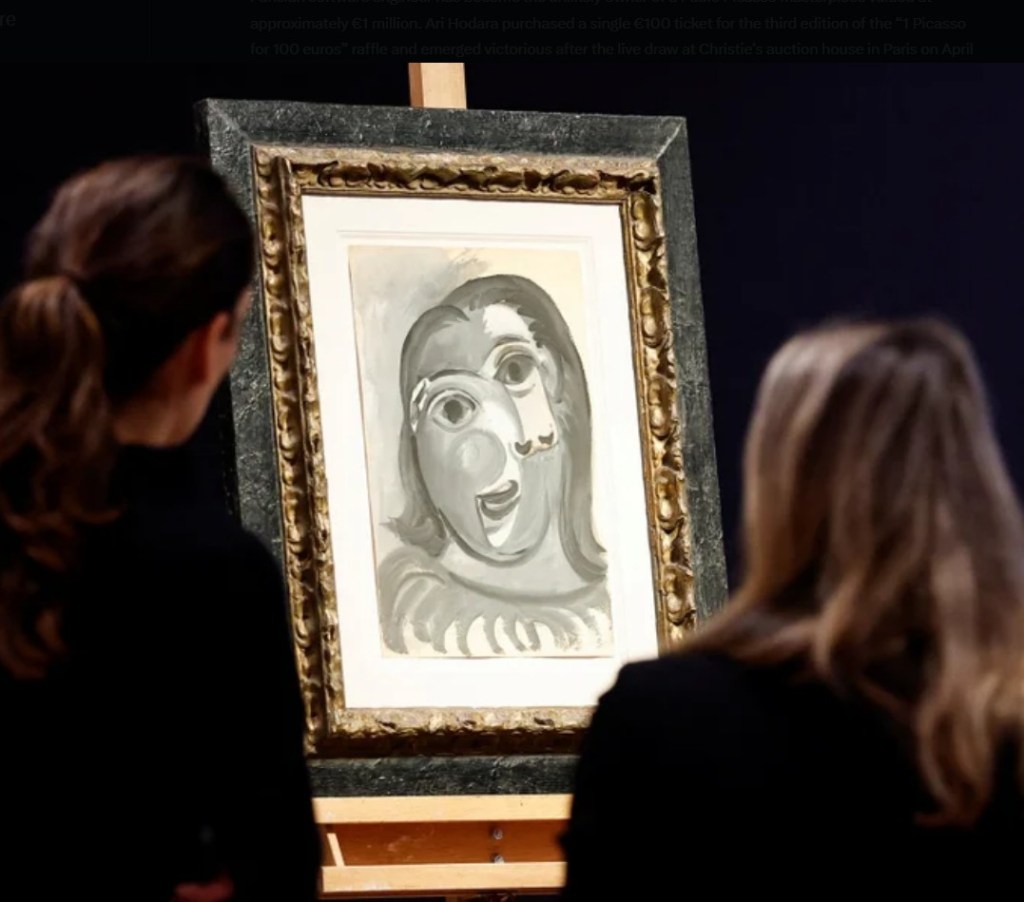 Two individuals observing a Picasso painting displayed in an ornate frame at an auction house.