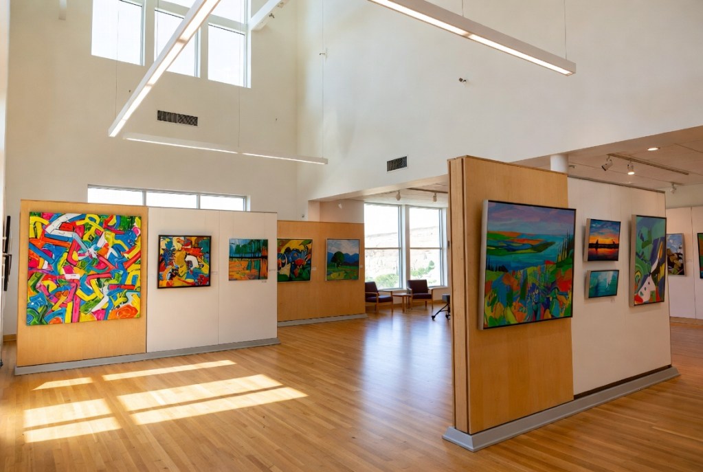 Jefferson City Art Club 2026 member exhibit at Missouri River Regional Library – colorful artworks on display in bright gallery space