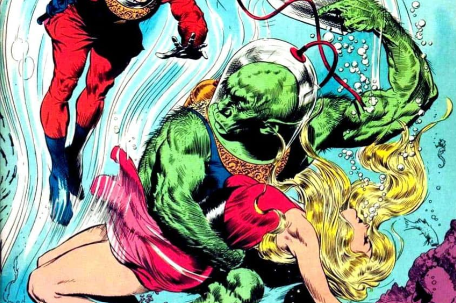 A superhero in a red outfit and a green-skinned creature underwater, interacting with a woman with long blonde hair wearing a red dress.