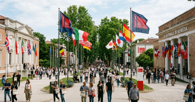 Visitors walking at La Biennale di Venezia entrance with international flags