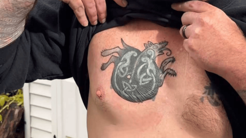 Shirtless Maine Senate candidate Graham Platner showing his updated chest tattoo after the cover-up.
